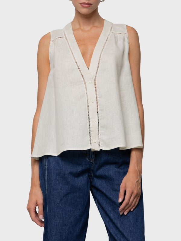 Top camicia smanicato in lino svasato con ricamo cut-out