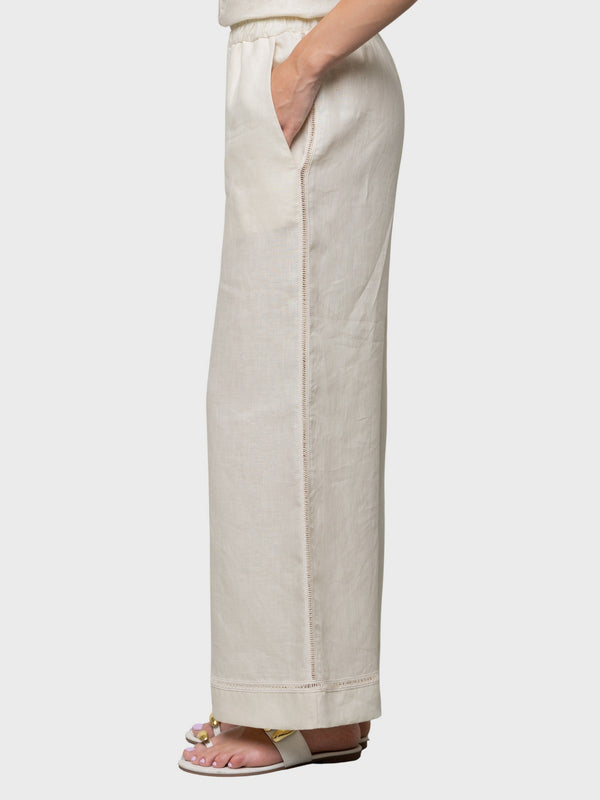 Pantalone in lino con elastico in vita e ricamo laterale