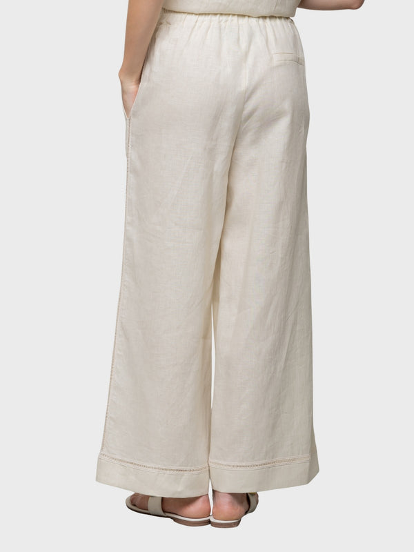 Pantalone in lino con elastico in vita e ricamo laterale
