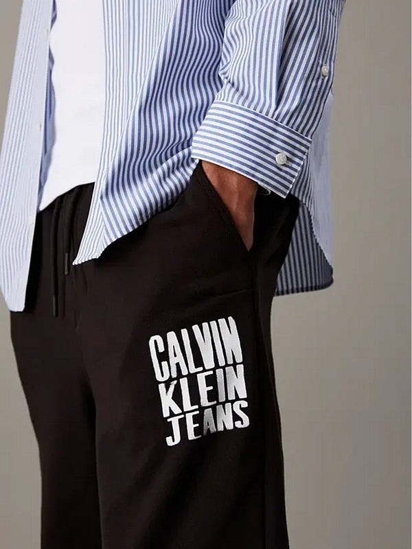 Pantaloni Uomo Calvin Klein - Pantaloni da tuta in spugna di cotone con logo - Nero